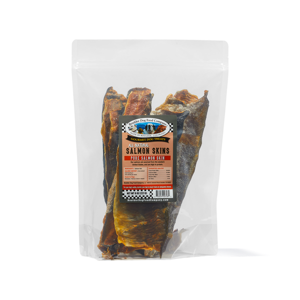 Packaged salmon skins dog treats in a clear plastic bag with a label showing the brand and product name.