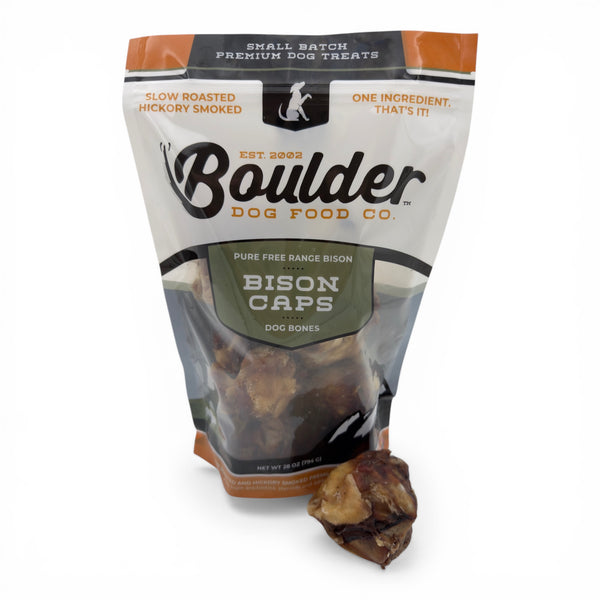 Boulder Dog Food Co. Baked Bison Caps, single-ingredient dog chews made from 100% bison kneecaps. Slow-roasted and hickory-smoked for a savory, long-lasting treat.