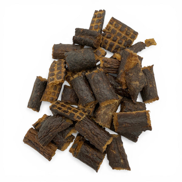 Close-up of Boulder Dog Food Bison Heart and Liver Bits, a nutrient-dense blend of 100% bison liver and heart. Naturally rich in CoQ10, Taurine, and Omega-3s for canine vitality.