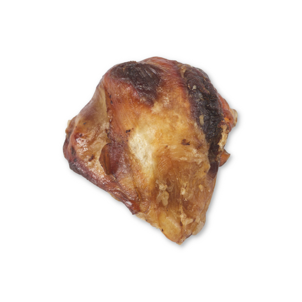 Close-up of a slow-roasted Boulder Dog Food Bison Cap. Showing the rich, hickory-smoked texture of a natural, digestible bison kneecap chew.