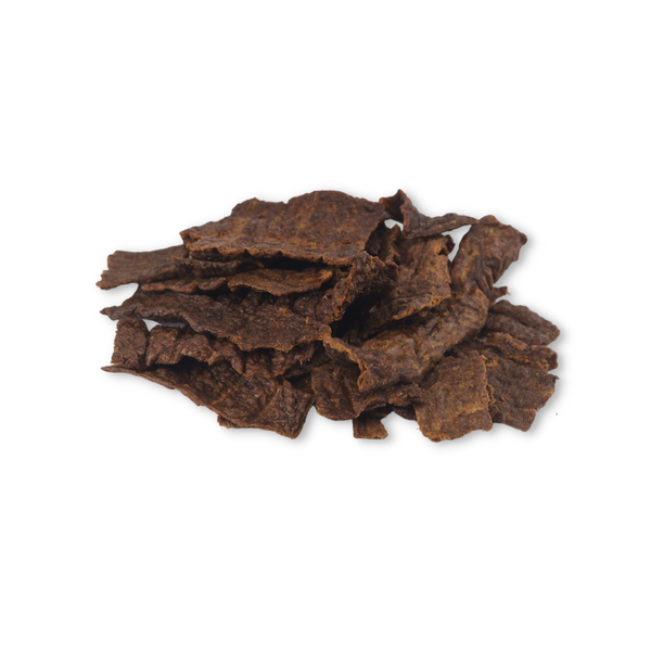 Close-up of Boulder Dog Food Bison Jerky, showing the rich texture of lean bison muscle meat. High-protein, low-fat jerky naturally rich in iron, zinc, and Omega-3s.