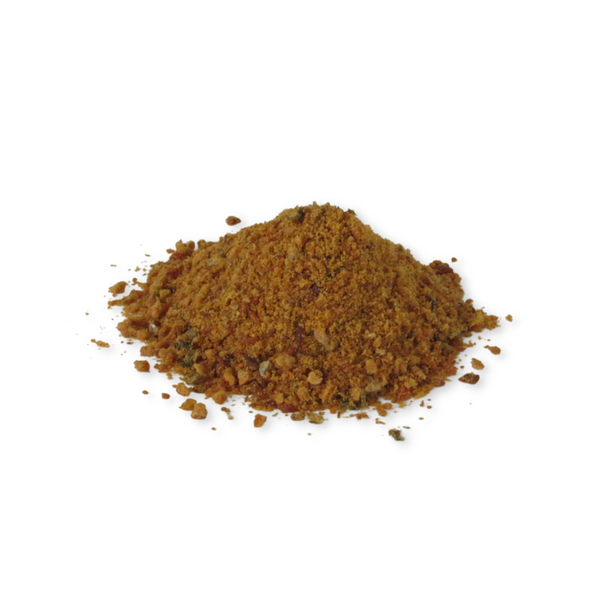 Close-up of finely ground wild-caught salmon topper, showing the rich, natural texture designed to easily sprinkle over kibble or wet food.
